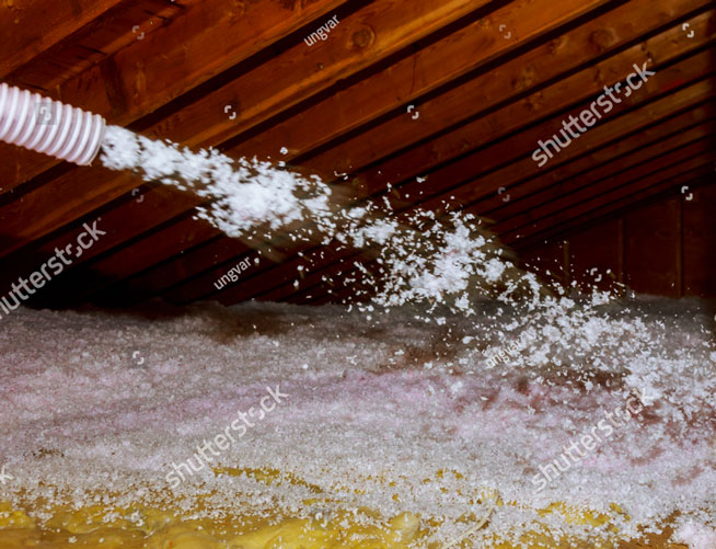 stock photo worker spraying mineral rock wool of house attic insulation 1188340273